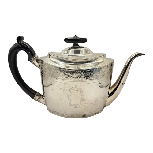 42 - A GEORGIAN SILVER OVAL TEAPOT
With ebonised wooden finial and handle and enrgraved decoration to bor... 