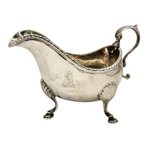 43 - RICHARD WILLIAMS, A GEORGIAN IRISH SILVER SAUCE BOAT
Having a single scrolled handle and gadrooned b... 