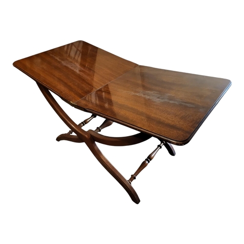 434 - A 20TH CENTURY MAHOGANY BUTLER'S TRAY AND STAND
Having four folding carry handles and stand, togethe... 