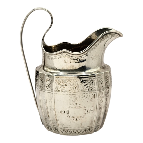 45 - A GEORGIAN SILVER CREAM JUG
Single handle with engraved decoration, hallmarked London, 1799.
(approx... 