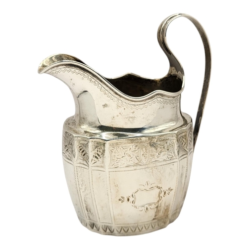 45 - A GEORGIAN SILVER CREAM JUG
Single handle with engraved decoration, hallmarked London, 1799.
(approx... 