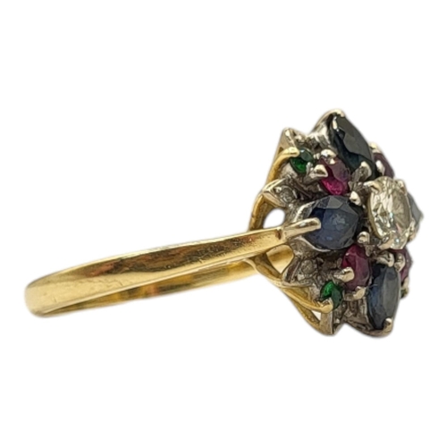 6 - A VINTAGE 18CT GOLD, DIAMOND AND GEM SET ‘TUTTI FRUTTI’ RING
The central round cut diamond edged wit... 