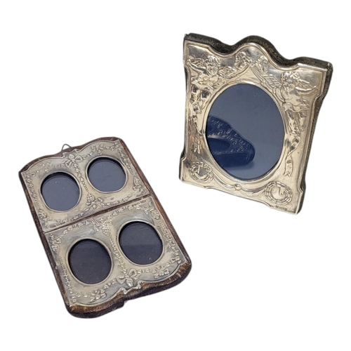 71 - TWO 20TH CENTURY SILVER PHOTOGRAPH FRAMES
Having an easel frame with embossed figures and a wall mou... 