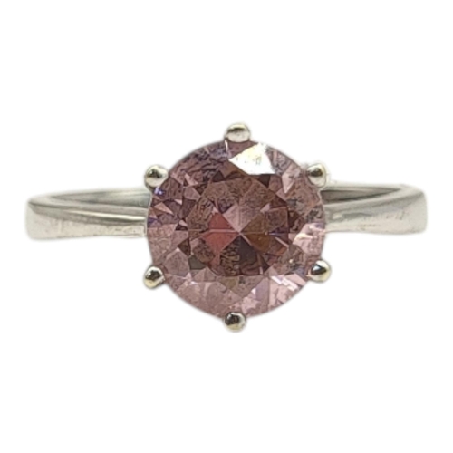 8 - A VINTAGE 9CT WHITE GOLD AND PINK TOURMALINE RING
The round cut stone in a plain design.
(size O)

C... 