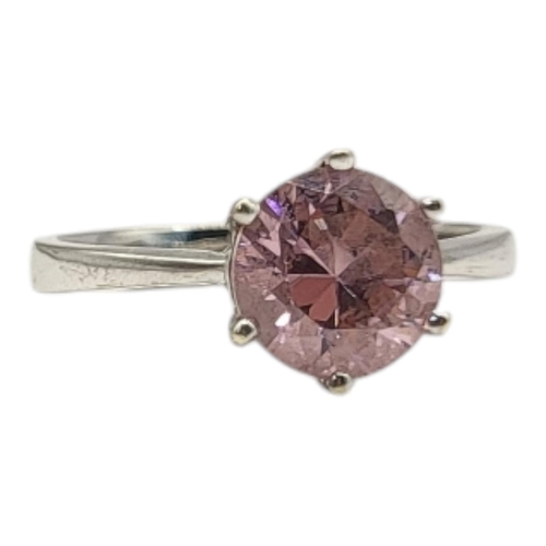 8 - A VINTAGE 9CT WHITE GOLD AND PINK TOURMALINE RING
The round cut stone in a plain design.
(size O)

C... 