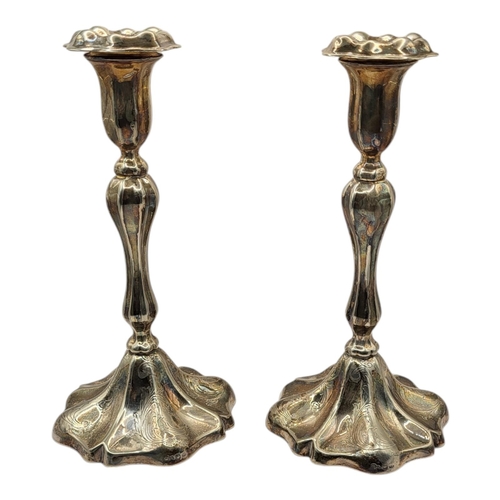 81 - A PAIR OF 19TH CENTURY SILVER PLATED CANDLESTICKS,
Fluted form with engraved decoration.
(approx 27c... 