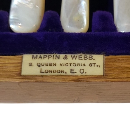 96 - MAPPIN AND WEBB, AN EDWARDIAN SILVER AND MOTHER OF PEARL CUTLERY SET
Having fine engraved decoration... 