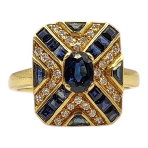 30A - AN 18CT GOLD, SAPPHIRE AND DIAMOND RING
The central oval cut sapphire set with baguette cut stones f... 