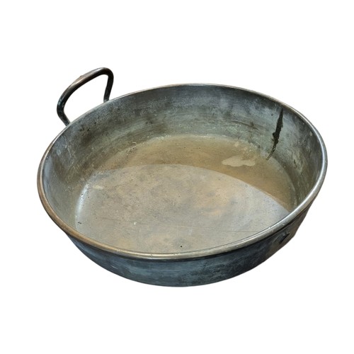 510 - A HEAVY LATE 19TH CENTURY BRONZE PAN
With single handle.
(33cm x 9cm)