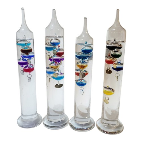 243 - A SET OF FOUR LATE 20TH CENTURY LAVA BUBBLE GLASS STYLE CYLINDRICAL TABLE CENTREPIECE
Firstly design... 