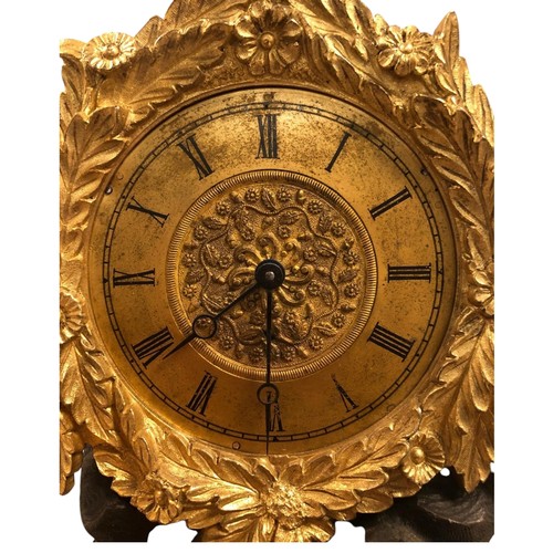 386 - A RARE MID 19TH CENTURY GILDED AND PATINATED BRONZE CASED MUSICAL TIMEPIECE
The circular dial surrou... 