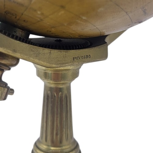 388 - AN EDWARDIAN EMPIRE GLOBE CLOCK
Eight day, with world timer, on brass stand engraved with presentati... 