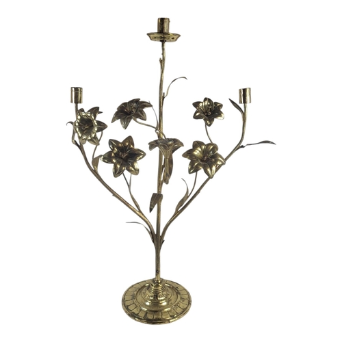 257 - A 19TH CENTURY FRENCH BRASS CANDELABRA
Two branch arms set with flowerheads, on a circular base.
(ap... 