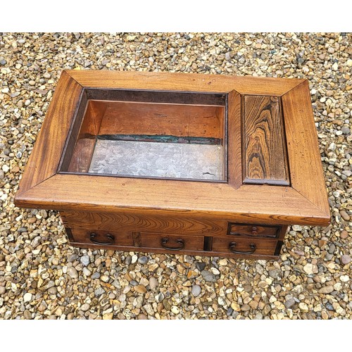 495 - A CHINESE ELM JARDINIERE CHEST
Fitted with drawers and copper lined planter.
(73cm x 49cm x 34cm)

C... 