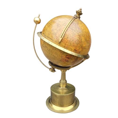 388 - AN EDWARDIAN EMPIRE GLOBE CLOCK
Eight day, with world timer, on brass stand engraved with presentati... 