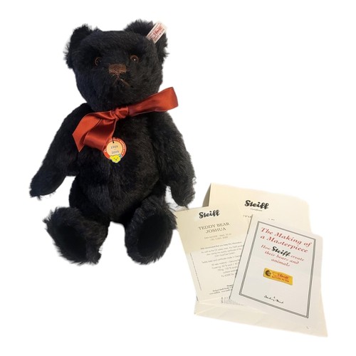 265 - STEIFF, A VINTAGE BLACK MOHAIR JOSHUA TEDDY BEAR
Limited edition number 556, retaining tag, complete... 