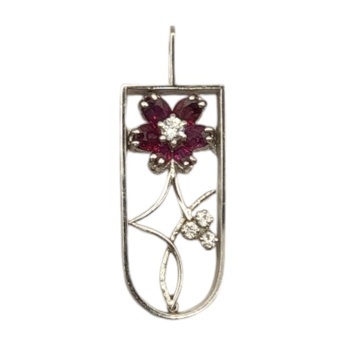 6B - AN 18CT WHITE GOLD,RUBY AND DIAMOND PENDANT
Floral cluster of oval cut rubies and round cut diamonds... 