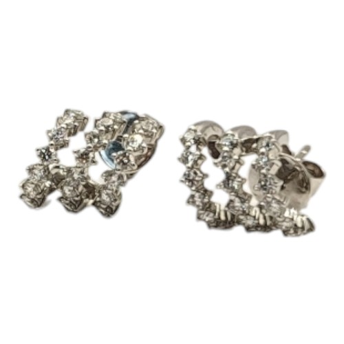 12B - A PAIR OF 18CT WHITE GOLD AND DIAMOND STUD EARRINGS
Three rows of round cut diamonds in a spiral des... 