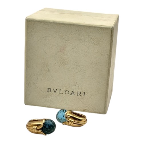 3B - BULGARI, A PAIR OF 18CT GOLD AND BLUE TOPAZ SET EARRINGS
Faceted blue tone stone in a cornucopia des... 