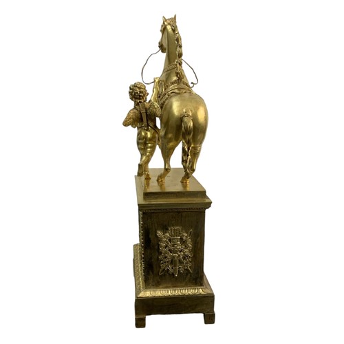 390 - VILLEMSRNS A PARIS, A 19TH CENTURY GILT CASED CLOCK
Mounted with winged cherub leading a horse, abov... 