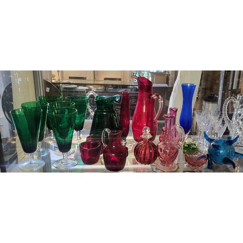 285 - A COLLECTION OF VINTAGE GLASSWARE
Comprising six green glass wine glasses, matching ewer, ruby glass... 