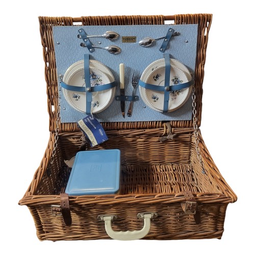 287 - A VINTAGE BREXTON PICNIC HAMPER 
Set with four cups and saucers, cutlery and tupperware box and wick... 