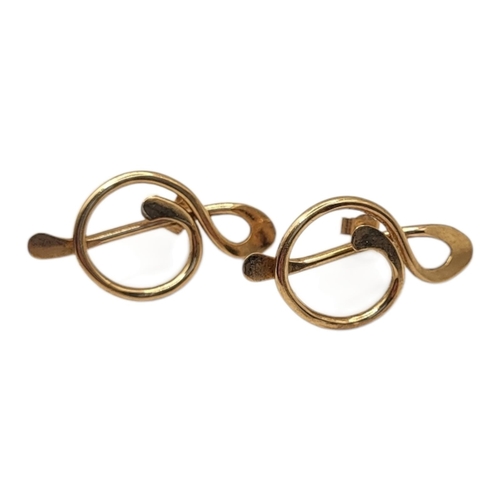 506 - A PAIR OF VINTAGE 9CT GOLD ‘MUSIC TREBLE NOTE’ EARRINGS
Each having a pierced design of a treble cle... 