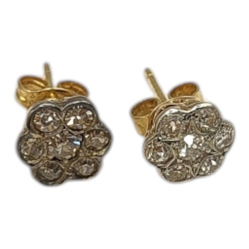 504A - A PAIR OF EARLY 20th CENTURY 18ct and DIAMOND EARRINGS,an arrangement of round cut diamonds forming ... 