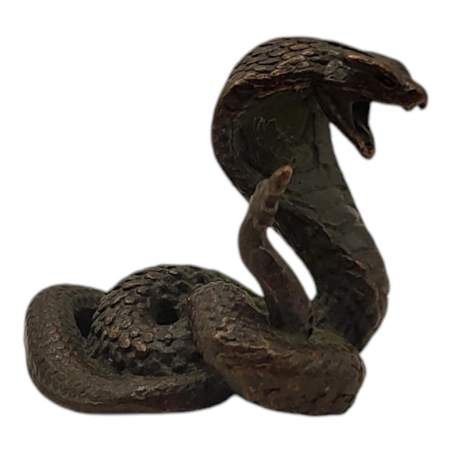 194 - A JAPANESE BRONZE KING COBRA FIGURINE
With four character mark impressed to base.
(4cm)

Condition: ... 