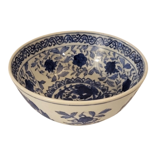 206 - A CHINESE BLUE AND WHITE PORCELAIN BOWL
With lotus and phoenix painted decoration, bearing Kangxi si... 