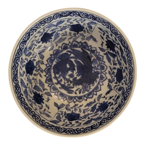 206 - A CHINESE BLUE AND WHITE PORCELAIN BOWL
With lotus and phoenix painted decoration, bearing Kangxi si... 