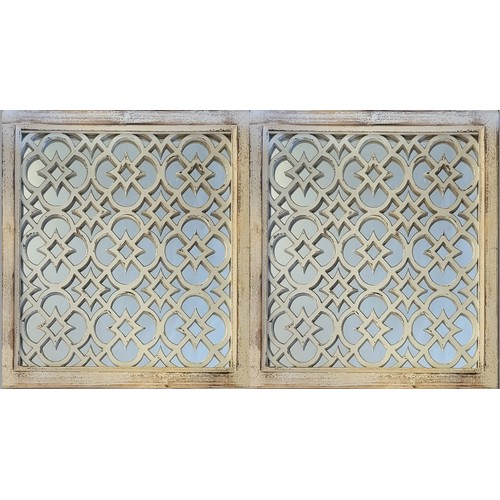 203 - A PAIR OF MOROCCAN STYLE WOODEN GARDEN MIRRORS
With overlaid geometric design.
(65cm x 65cm)


Condi... 