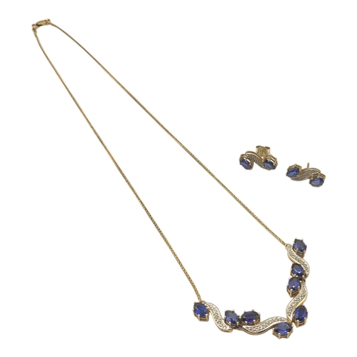 20 - A 14CT GOLD, SAPPHIRE AND DIAMOND NECKLACE AND EARRINGS SET
Set with oval cut sapphires interspersed... 