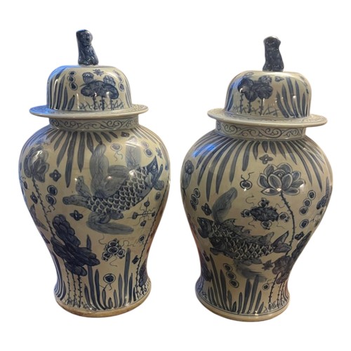 212 - A PAIR OF CHINESE STYLE 20TH CENTURY BLUE AND WHITE CERAMIC GINGER JARS
Painted with koi and lotus m... 