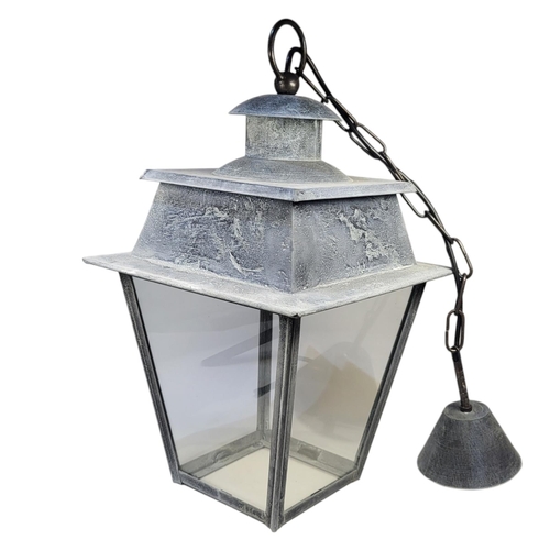 270 - A VICTORIAN STYLE STEEL LANTERN
With caddy top above four tapering glass panels.

Condition: good th... 