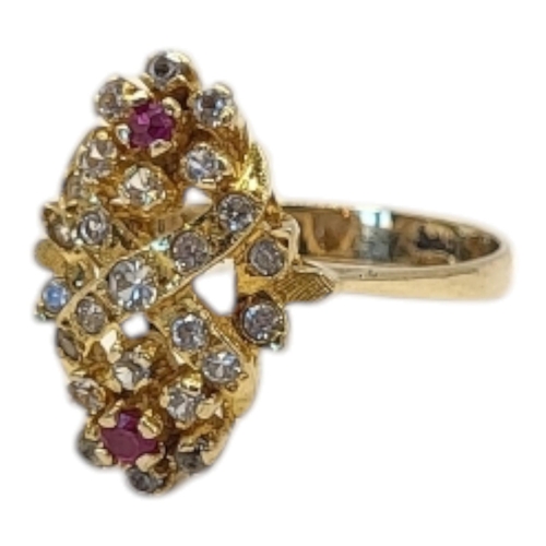 25 - A VINTAGE 14CT GOLD, RUBY AND DIAMOND CLUSTER RING
Two round cut rubies edged with diamonds in a pie... 