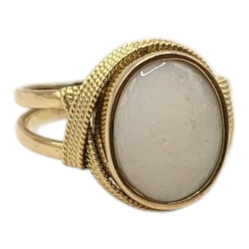 28 - A VINTAGE 18CT GOLD AND OPAL RING
Cabochon cut opal set in a pierced ribbon design.
(size Q)

Condit... 