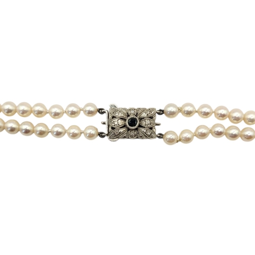 55 - AN EARLY 20TH CENTURY WHITE GOLD,SAPPHIRE AND DIAMOND PEARL NECKLACE
The rectangular form clasp set ... 