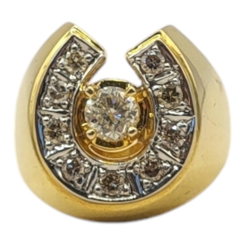 24 - A VINTAGE YELLOW METAL DIAMOND HORSESHOE RING
The arrangement of round cut diamonds forming a horses... 