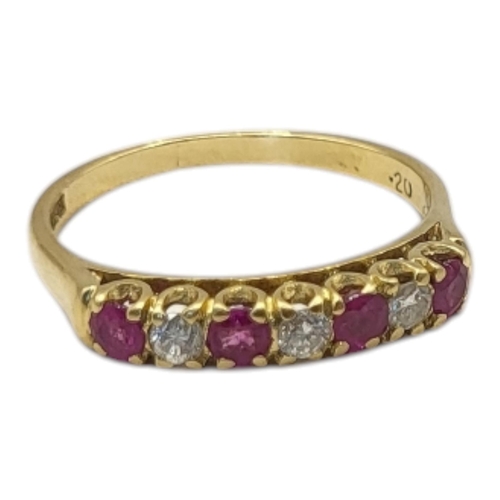 27 - A VINTAGE 18CT GOLD, RUBY AND DIAMOND RING
Having a row of round cut rubies interspersed with diamon... 