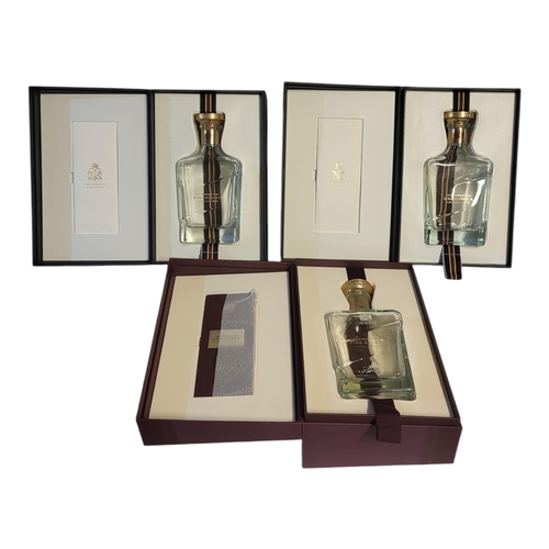 297 - JOHN WALKER AND SONS, THREE CASED ‘KING GEORGE V’ WHISKY BOTTLES
Two in plain grey boxes and one bur... 