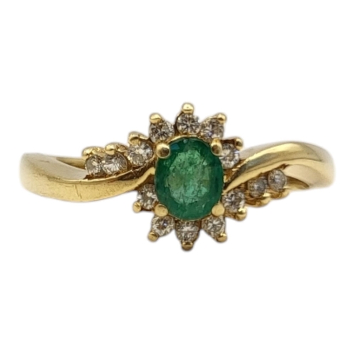 36 - A VINTAGE 18CT GOLD, EMERALD AND DIAMOND RING
Oval cut emerald edged with diamonds
(approx emerald w... 