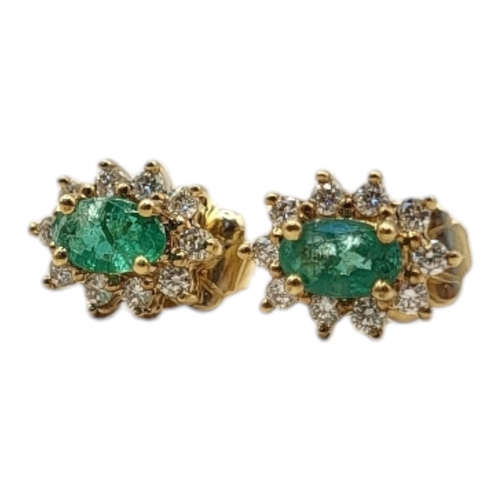 37 - A PAIR OF 9CT GOLD, EMERALD AND DIAMOND EARRINGS
Set with oval cut emerald edged with diamonds.
(app... 