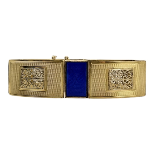 38 - A CONTINENTAL 14CT YELLOW METAL AND ENAMEL BRACELET
The rectangular blue guilloché enamel panels wit... 