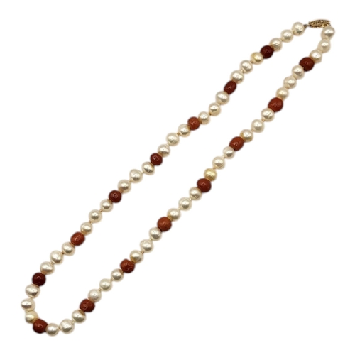 60 - A CHINESE 14CT GOLD, CORAL AND PEARL NECKLACE
Coral beads interspersed with pearls on a 14ct gold cl... 