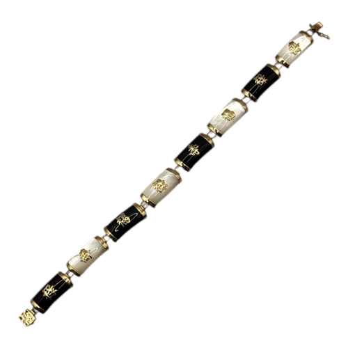 62 - A VINTAGE CHINESE 9CT GOLD MOTHER OF PEARL AND ONYX BRACELET
Convex links with applied Chinese chara... 