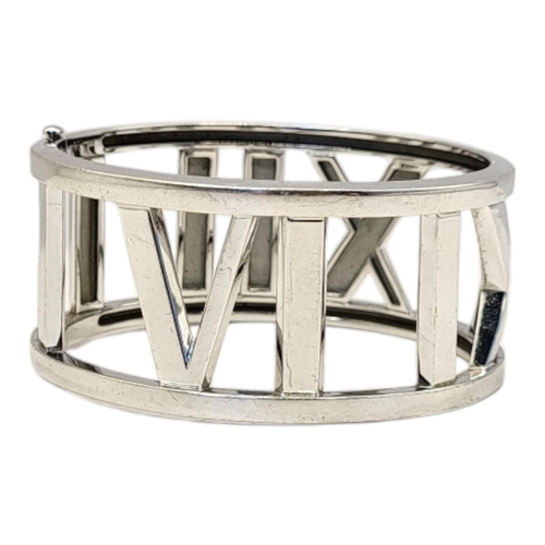 68 - TIFFANY, A VINTAGE 18CT WHITE GOLD ‘WIDE ATLAS’ BRACELET
The wide band with Roman numerals, marked ‘... 