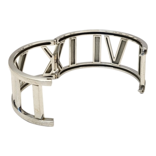 68 - TIFFANY, A VINTAGE 18CT WHITE GOLD ‘WIDE ATLAS’ BRACELET
The wide band with Roman numerals, marked ‘... 