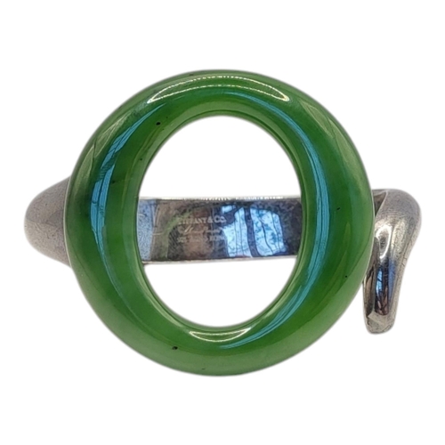 70 - TIFFANY AND CO., A VINTAGE SILVER ELSA PERETTI SEVILLANA GREEN JADE ROUND ‘O’ CUFF BRACELET
A carved... 