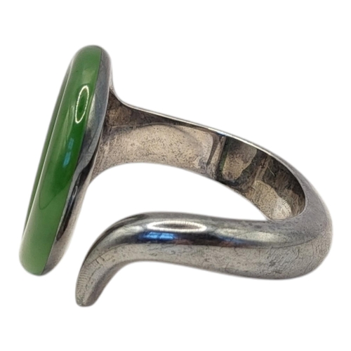 70 - TIFFANY AND CO., A VINTAGE SILVER ELSA PERETTI SEVILLANA GREEN JADE ROUND ‘O’ CUFF BRACELET
A carved... 